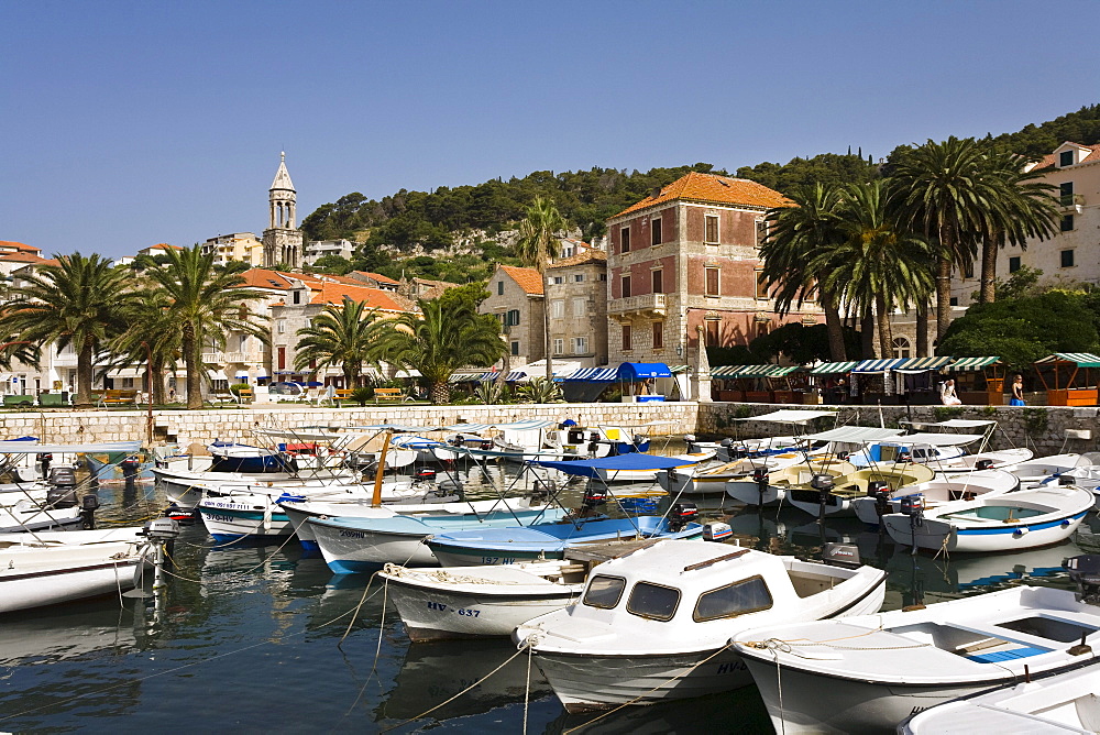 View at boats at harbour and the Old Town of Hvar, Hvar Island, Dalmatia, Croatia, Europe