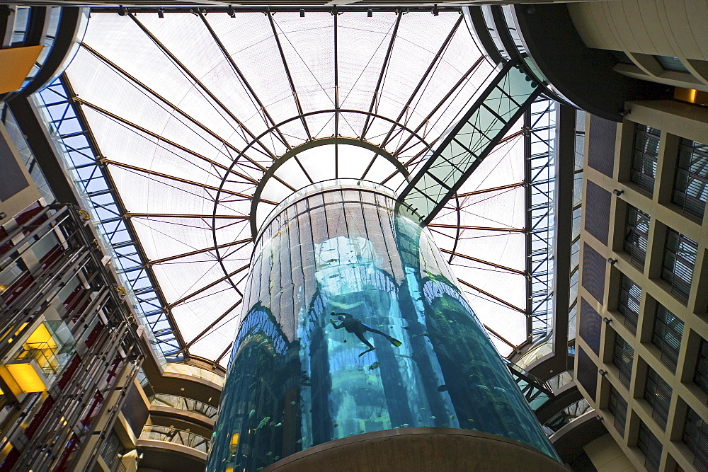 the 5 star Radisson SAS Hotel features the world's largest cylindrical aquarium. entrance to Aqua Dom, a diver cleans the tank, Berlin, Germany