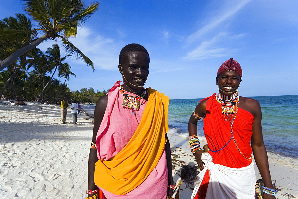 Two Massai wearing traditional clothing at Shanzu Beach, Coast, Kenya