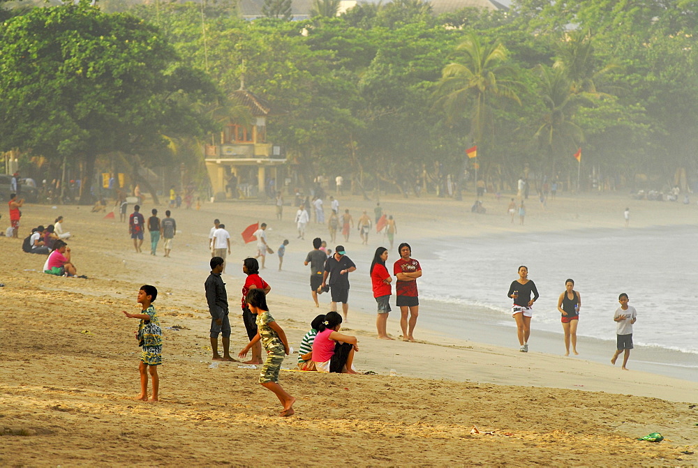 Local people at Kuta beach in the morning, Kuta, Bali, Indonesia, Asia