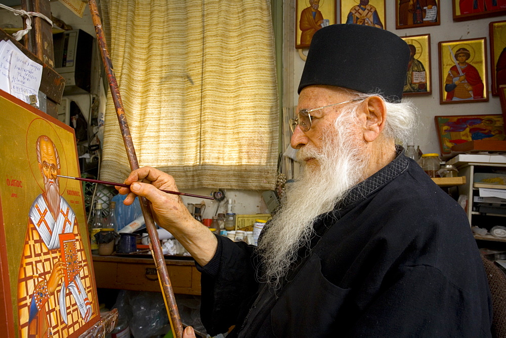 Icon painter Father Kallinikos painting an icon, Stravrovouni monastery, Larnaka, South Cprus, Cyprus