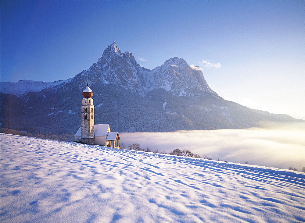 Saint Valentine's church on a sunny day in winter, Siusi, South Tyrol, Italy, Europe