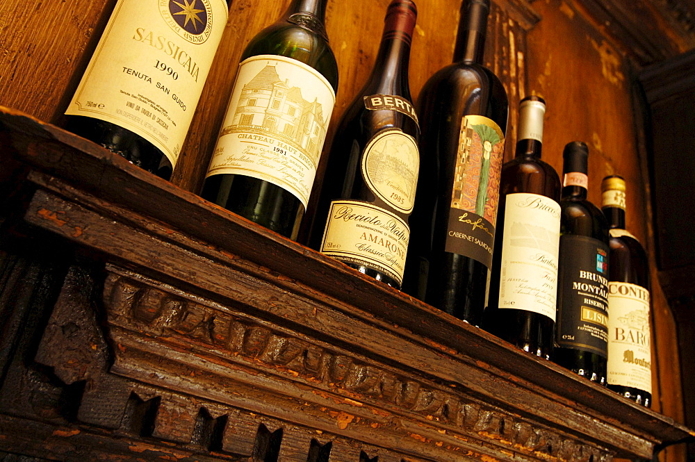 View at wine bottles at the restaurant of guesthouse Zur Rose, Kurtatsch, South Tyrol, Italy, Europe