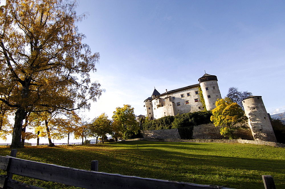 Proesels castle and autumnal trees in the sunlight, Voels am Schlern, South Tyrol, Italy, Europe