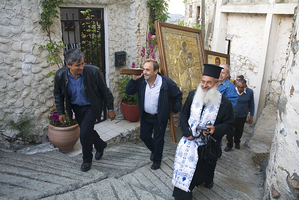 Icon procession with priester, People holding icons during the procession, Orthodox icon procession, Agros, Troodos mountains, South Cyprus, Cyprus