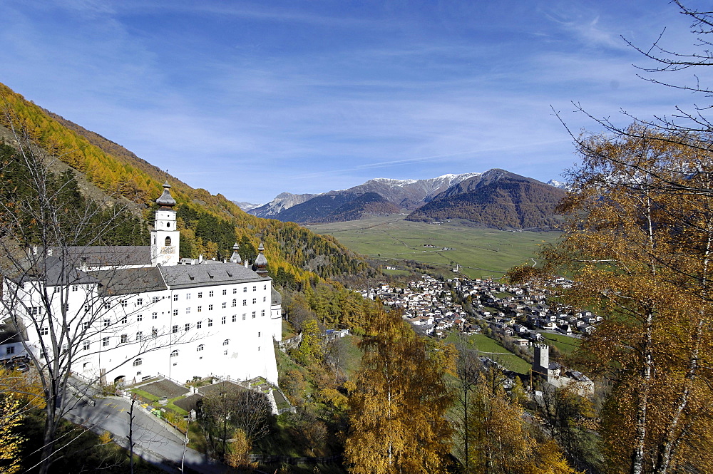 Marienberg abbey in the sunlight and view at a village in a valley, Burgeis, Mals, Val Venosta, South Tyrol, Italy, Europe