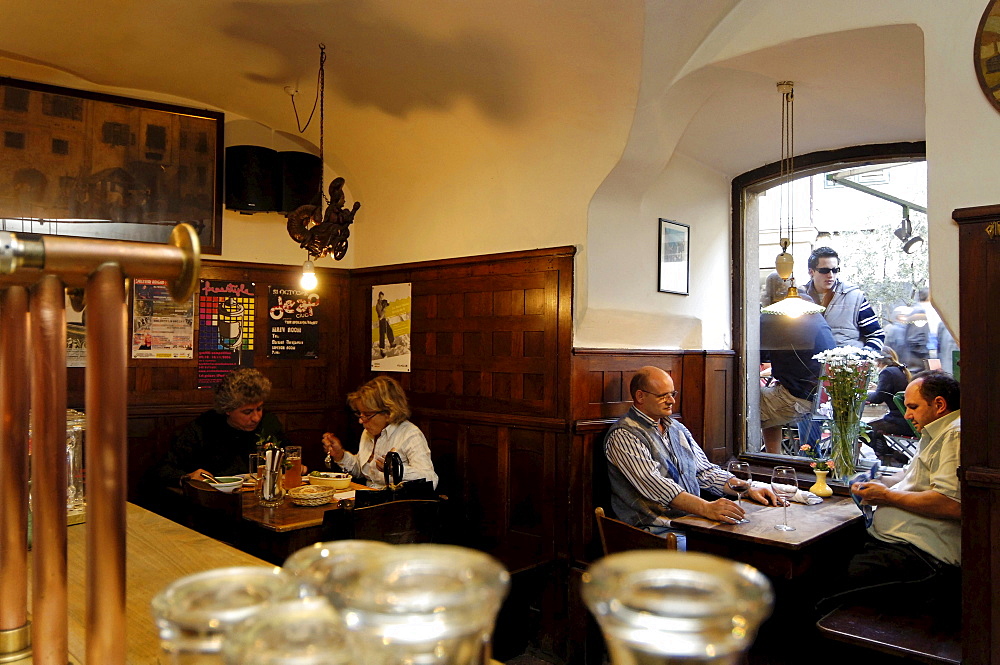 People sitting in the dining area of the brewery Hopfen & Co., Bozen, South Tyrol, Italy, Europe