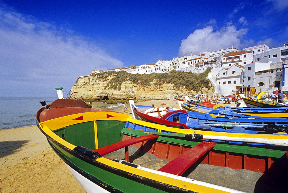 Fishing boats on the beach in the sunlight, Carvoeiro, Algarve, Portugal, Europe