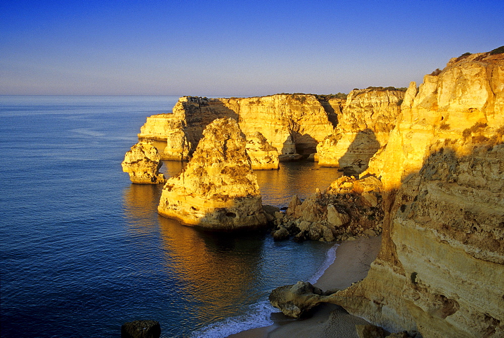 Beach and rocky coast under blue sky, Praia da Marinha, Algarve, Portugal, Europe