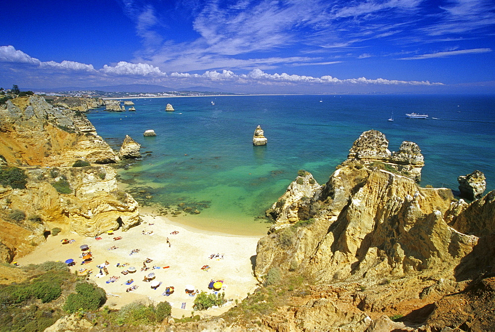 Beach and rocky coast in the sunlight, Praia do Camilo, Algarve, Portugal, Europe