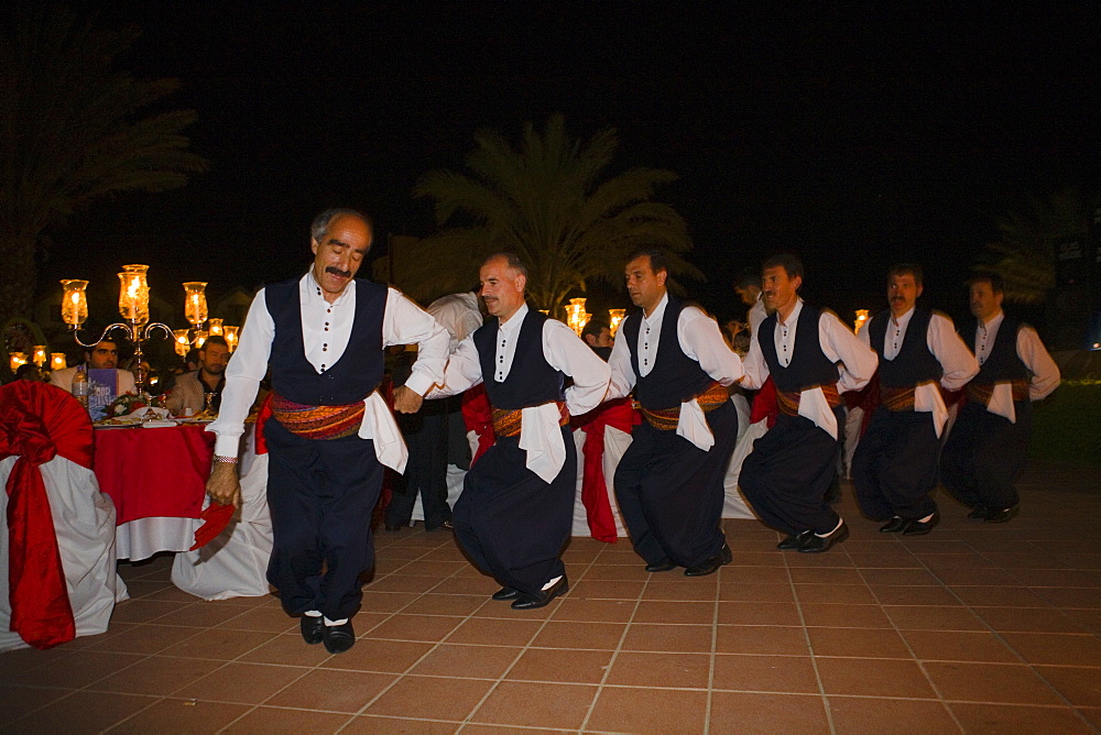 A small group of local men dancing in traditional costume, Folklore, Folk dance, Salamis Bay Conti Resort Hotel, Salamis, North Cyprus, Cyprus