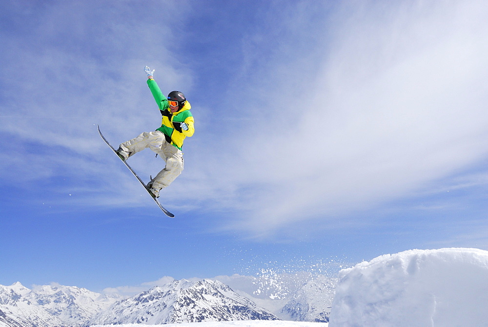 Snowboarder in mid-air, ski area Soelden, Oetztal, Tyrol, Austria