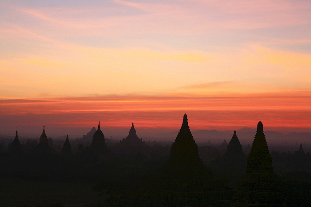 Sunrise over temple towers at the plain of Bagan, Myanmar, Burma, Asia