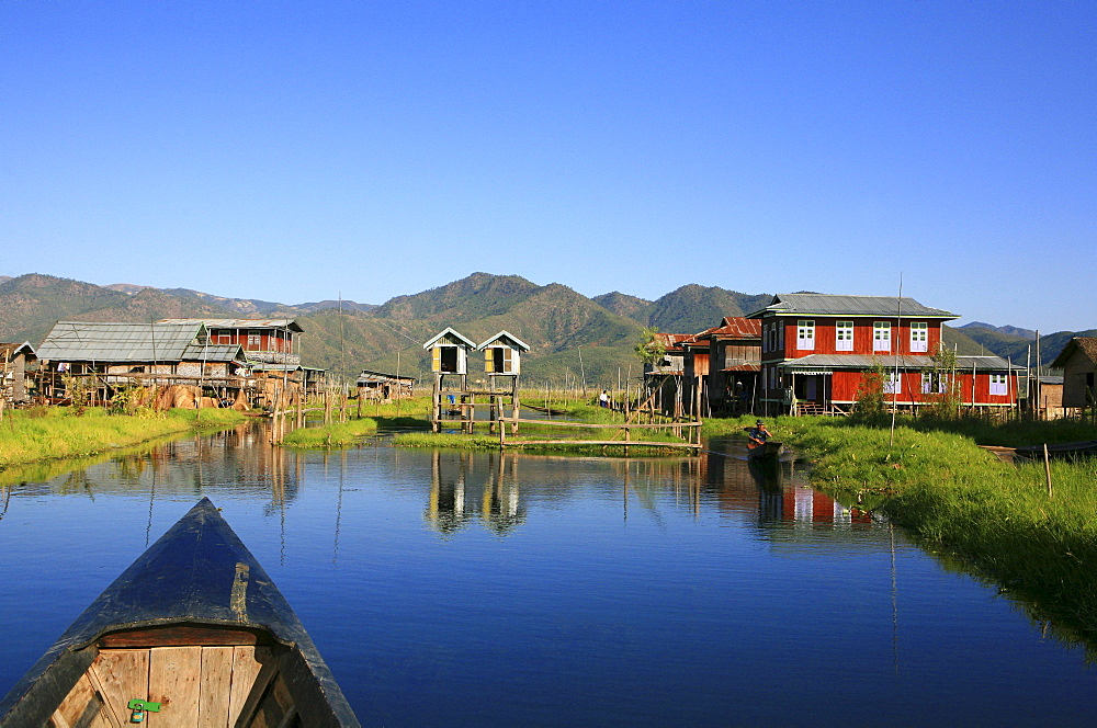 Village with stilt houses of the Intha people under blue sky, Inle Lake, Shan State, Myanmar, Burma, Asia