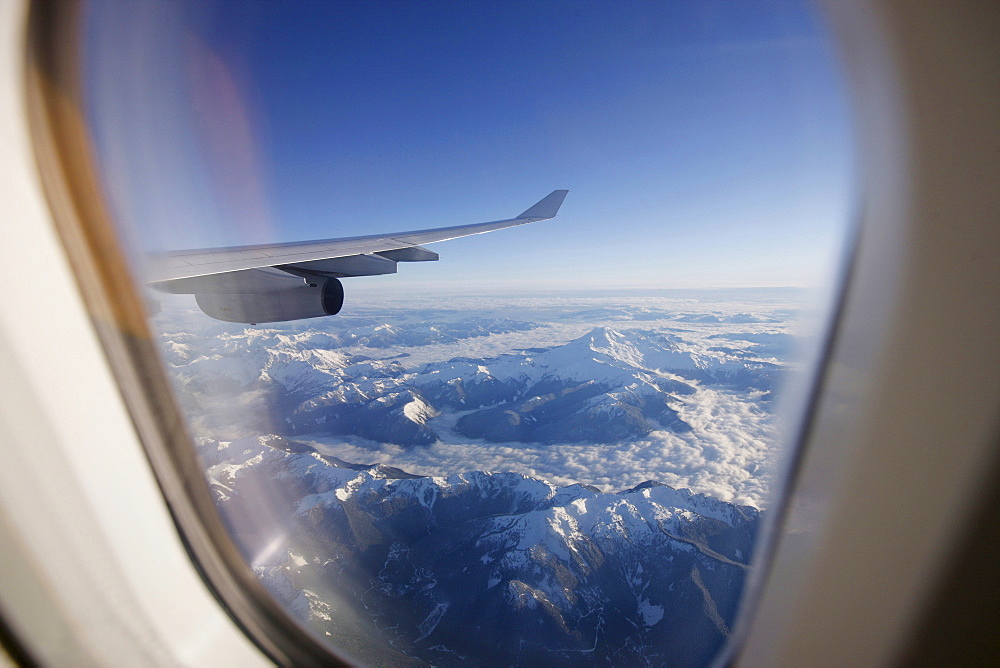 View through airplane window over Rocky Mountains, Oregon, USA