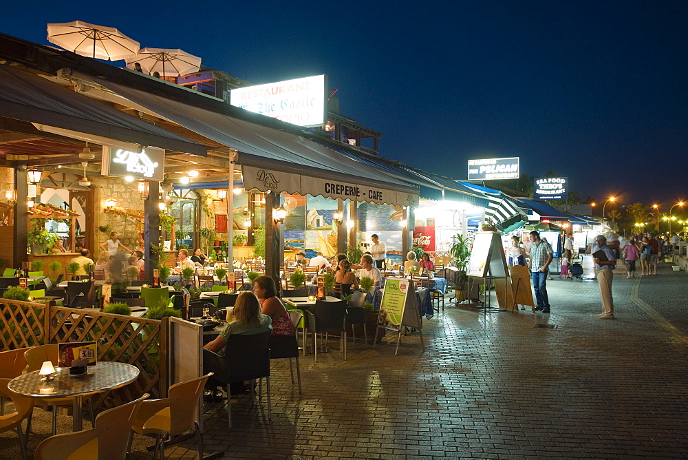 Restaurant, cafe along the harbour promenade at night, Paphos, South Cyprus, Cyprus