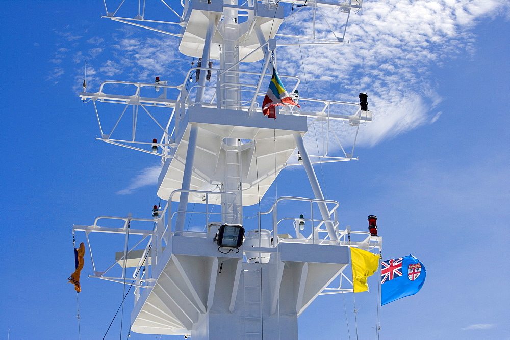 Fijian Flag on cruiseship MV Columbus under blue sky, Fiji Islands, South Pacific, Oceania