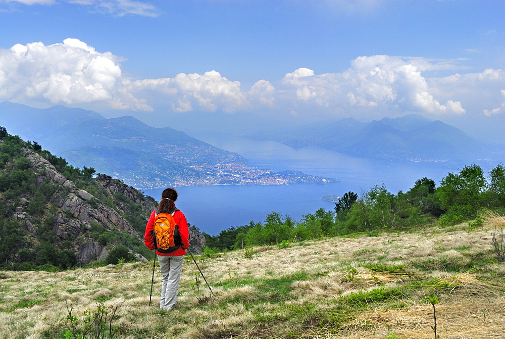 Woman looking at lake Maggiore with Verbania, Mottarone, Stresa, lake Maggiore, Piemont, Italy