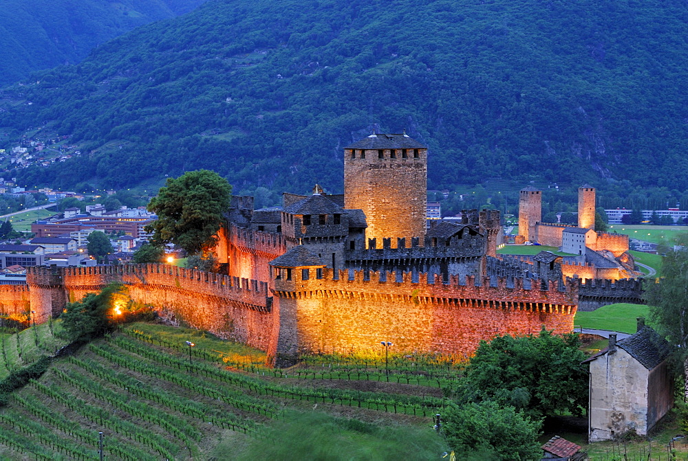 Illuminated castle Castello di Montebello and castle Castelgrande in background in UNESCO World Heritage Site Bellinzona, Bellinzona, Ticino, Switzerland