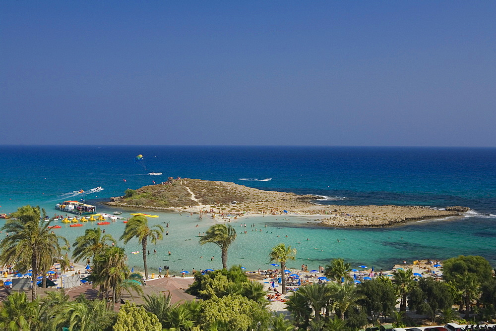 View of Nissi beach with palm trees, Agia Napa, South Cyprus, Cyprus