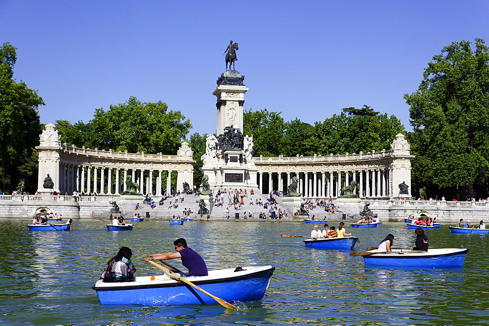 People relaxing near Monument to Alfonso XII, Parque del Buen Retiro, Madrid, Spain