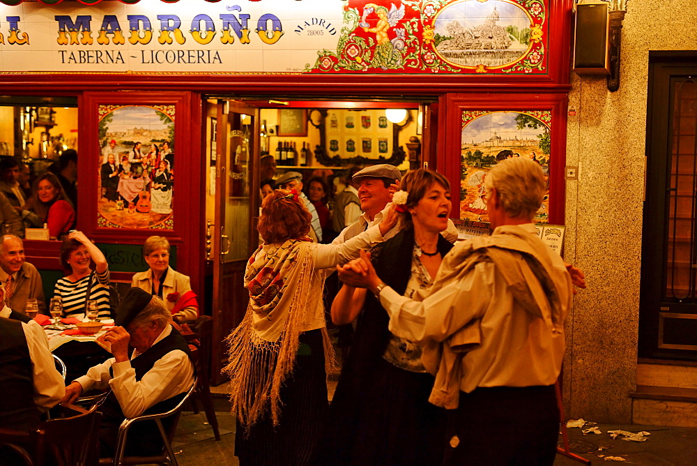 Couples dancing in front of Madrono restaurant, Fiestas de San Isidro Labrador, Madrid, Spain