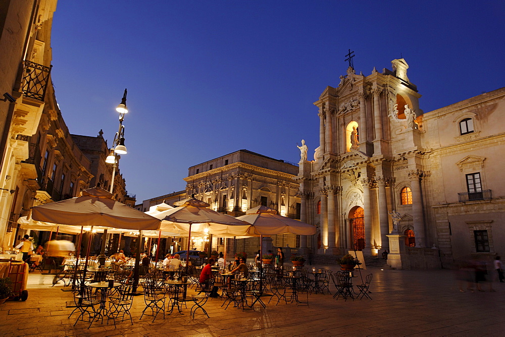 Place Cathedral with pavement cafe and cathedral in the evening, Syracuse, Ortygia island, Sicily, Italy