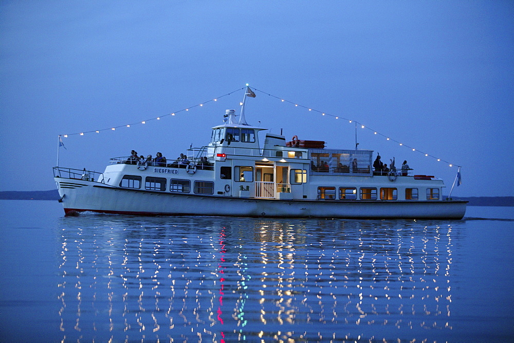 Ferryboat on Lake Chiemsee in the evening, Fraueninsel, Chiemgau, Bavaria, Germany