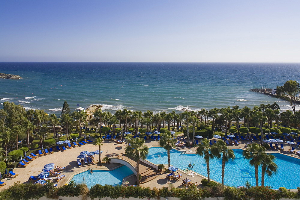 Swimming Pool surrounded by palm trees, Hotel Hawai, Limassol, Cyprus