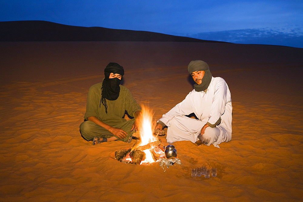 tuaregs preparing tea at campfire, Libya, Africa