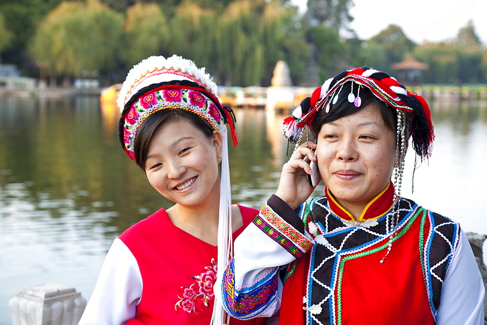 Portrait of two Chinese women wearing traditional costumes, Bai minority, Dianchi Lake, Daguan Park, north-west of Kunming City, Kunming, Yunnan, People's Republic of China, Asia