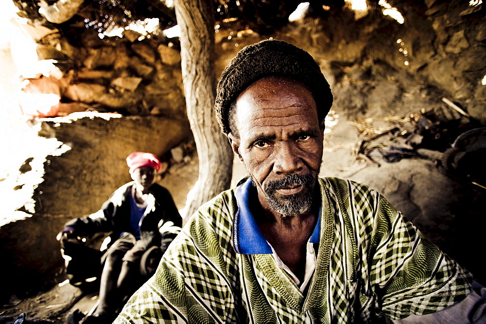 African blacksmith and a helper in a hut, Sangha, La Falaise de Bandiagara, Mali, Africa