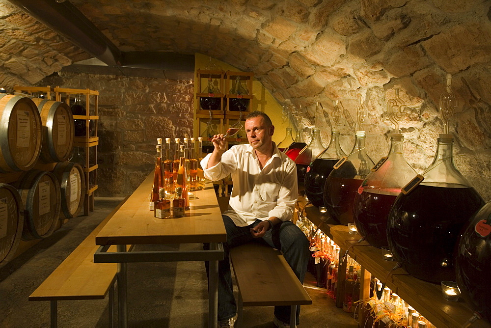 Proprietor Juergen H. Krenzer in the Apple Wine and Sherry Cellar at Rhoener Schau-Kelterei, Gasthof Zur Krone, Das Rhoenschaf-Hotel, Ehrenberg, Seiferts, Rhoen, Hesse, Germany