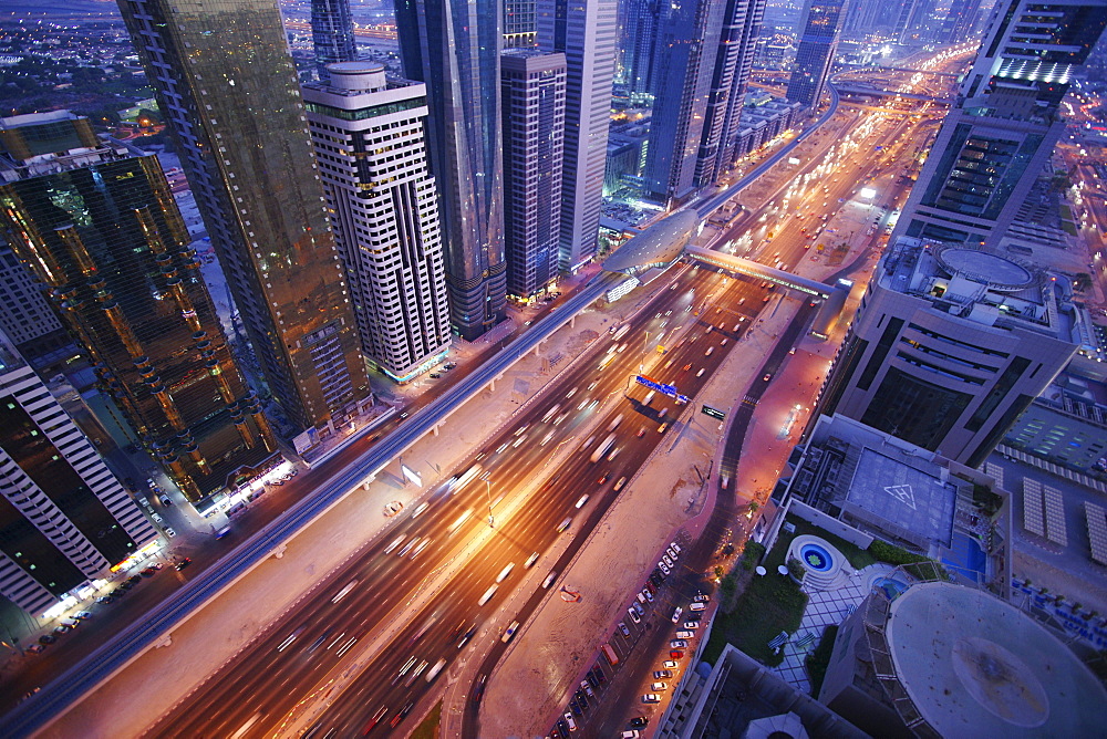 High rise buildings along Sheikh Zayed Road in the evening, Dubai, UAE, United Arab Emirates, Middle East, Asia
