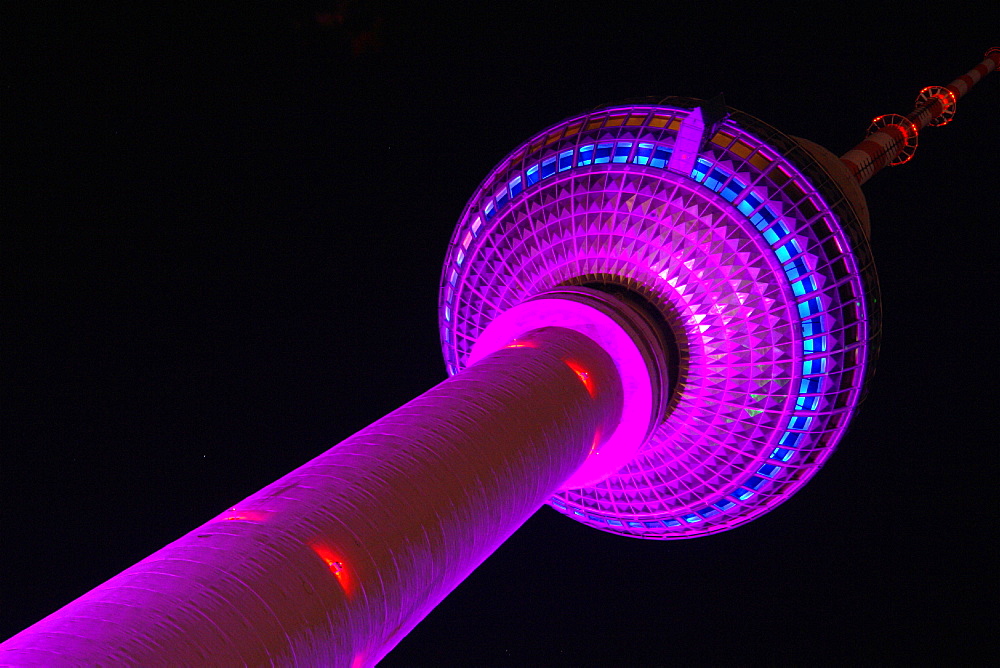 Illuminated Television Tower at night, View from foot of the tower, Berlin, Germany