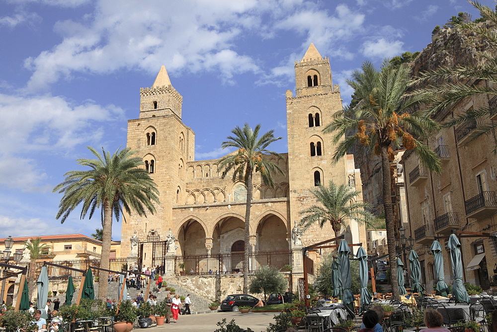 People at San Salvatore Cathedral at the square Piazza Duomo in Cefalu, Province Palermo, Sicily, Italy