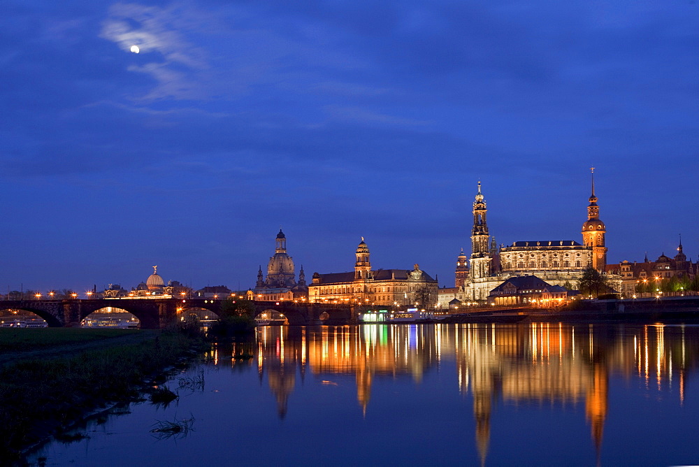 City view with the Elbe River and moon, Augustus Bridge, Frauenkirche, Church of our Lady, Staendehaus, town hall tower, Hofkirche and Hausmanns tower, tower of Dresden Castle, Dresden, Saxony, Germany