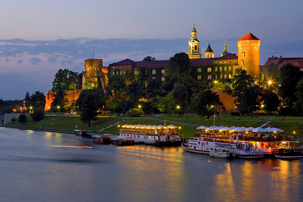 Wisla River and the Wawel Royal Castle at night, Krakow, Poland, Europe