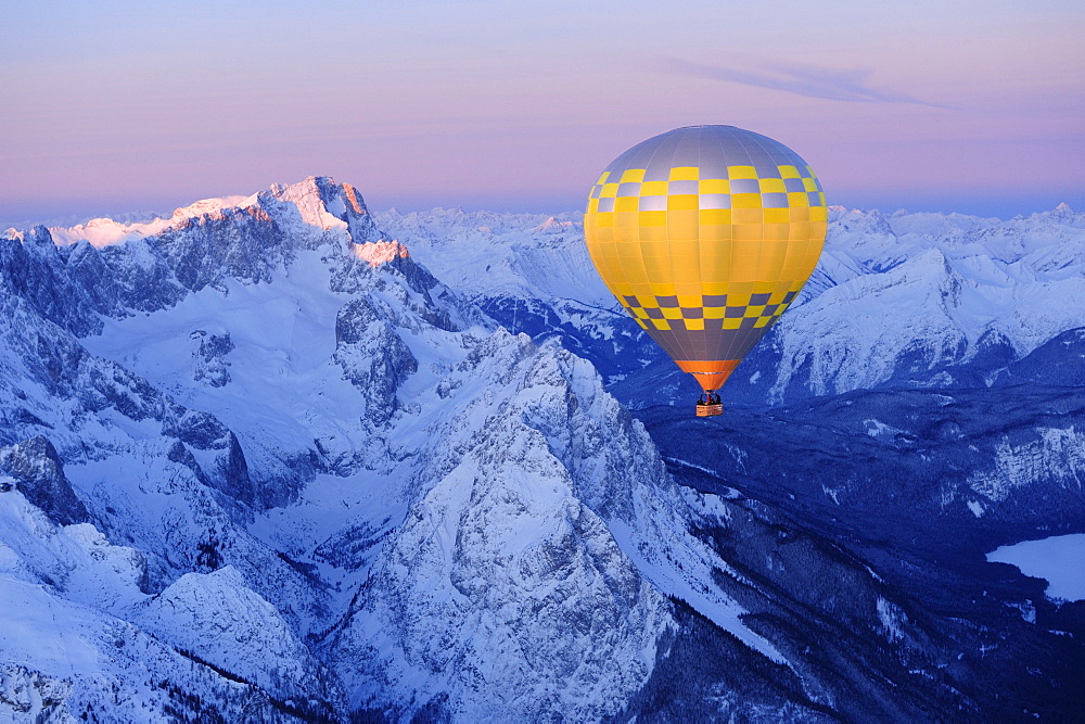 Aerial view of hot-air balloon flying above Zugspitze and Waxensteine, Garmisch-Partenkirchen, Wetterstein range, Bavarian alps, Upper Bavaria, Bavaria, Germany, Europe