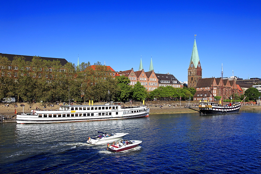 Ships on the Weser river at Martini pier, Martini church, Hanseatic City of Bremen, Germany, Europe