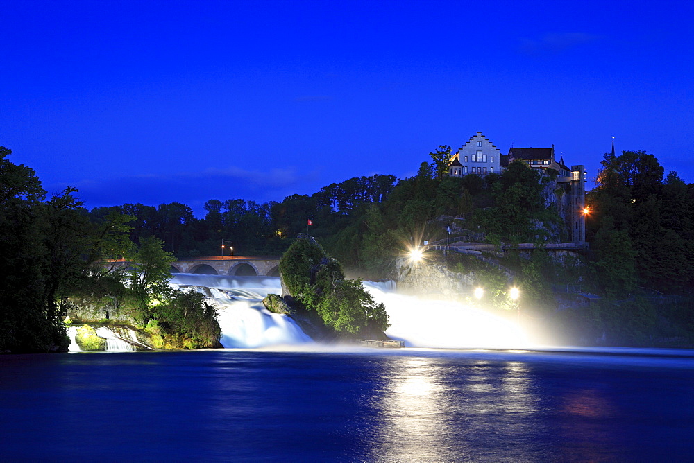 The illuminated Rhine Falls near Schaffhausen in the evening, Laufen castle, High Rhine, Canton Schaffhausen, Switzerland, Europe