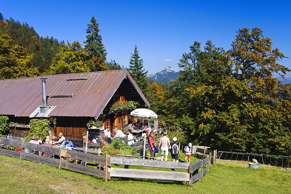 Hikers taking a rest at the Mitterhuetter alpine hut, Mountain hiking, Hochalm, Alps, Upper Bavaria, Germany, Europe