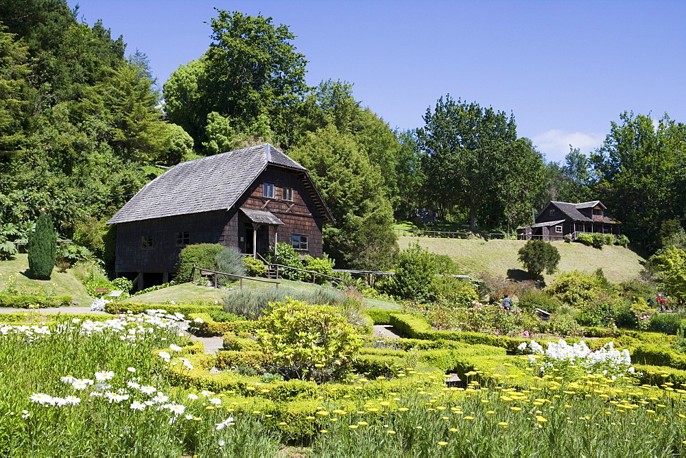 Watermill in gardens in the sunlight, Museo Colonial Aleman of the Universidad Austral de Chile, Frutillar, Los Lagos, Patagonia, Chile, South America, America