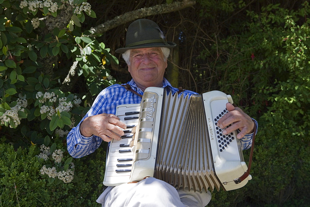 Friendly accordeon player outside Museo Colonial Aleman of the Universidad Austral de Chile, Frutillar, Los Lagos, Patagonia, Chile, South America, America