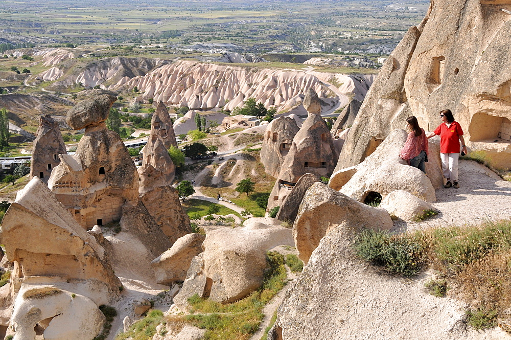 Two women looks at a valley near Uechisar, Cappadocia, Anatolia, Turkey