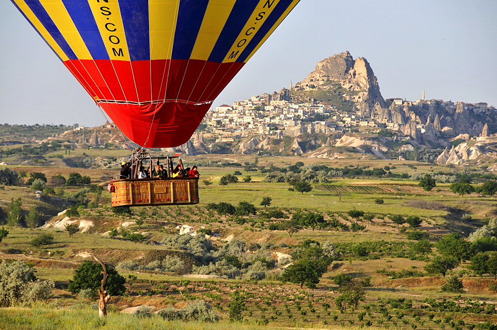 People in the basket ballooning in the valley of Goereme, Cappadocia, Anatolia, Turkey