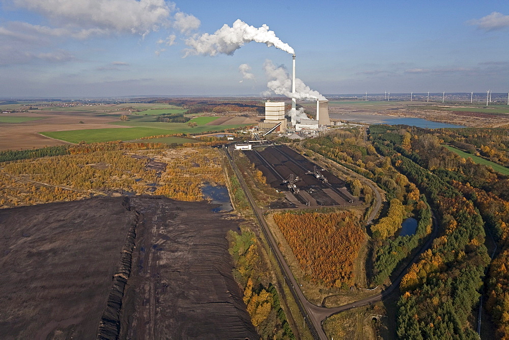 Aerial view of a lignite open-pit mine at fossil-fuel power station Buschhaus, cooling towers in the background, Helmstedt, Lower Saxony, northern Germany