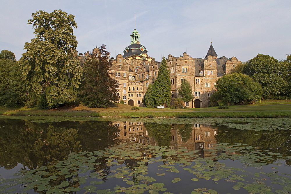 Bueckeburg Castle and moat with reflection, Bueckeburg, Lower Saxony, northern Germany