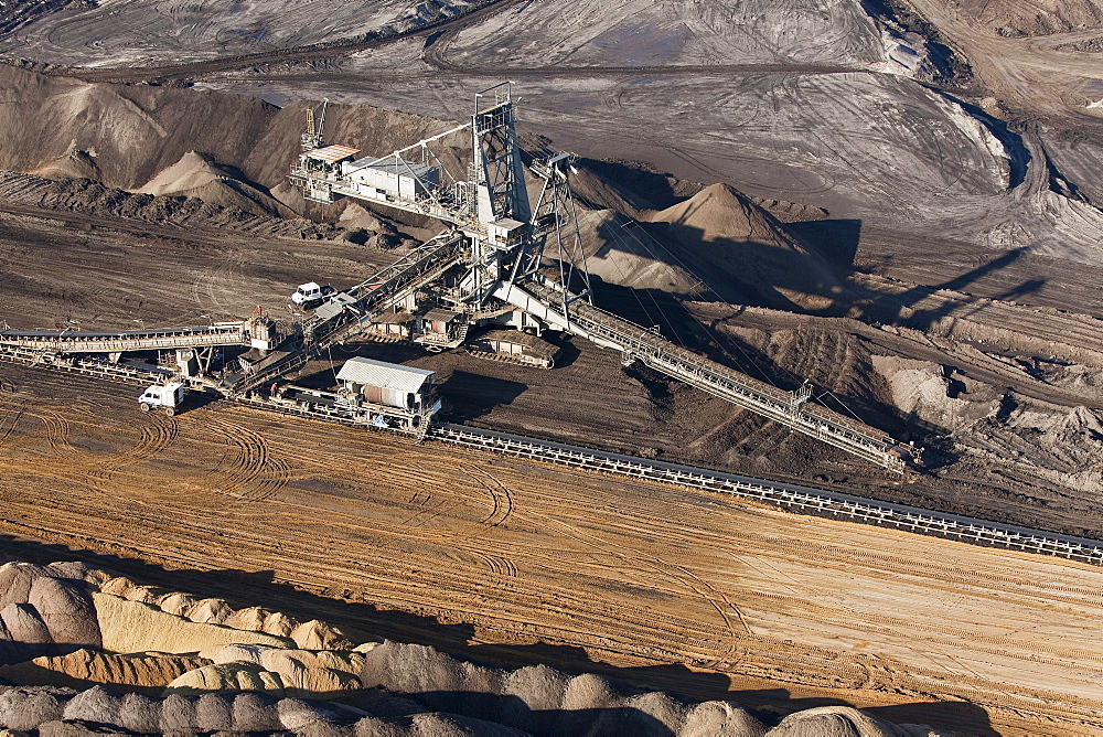 Aerial view of a bucket-wheel excavator with conveyor belt in for open-pit lignite mining, brown coal, Schoeningen, Lower Saxony, Germany