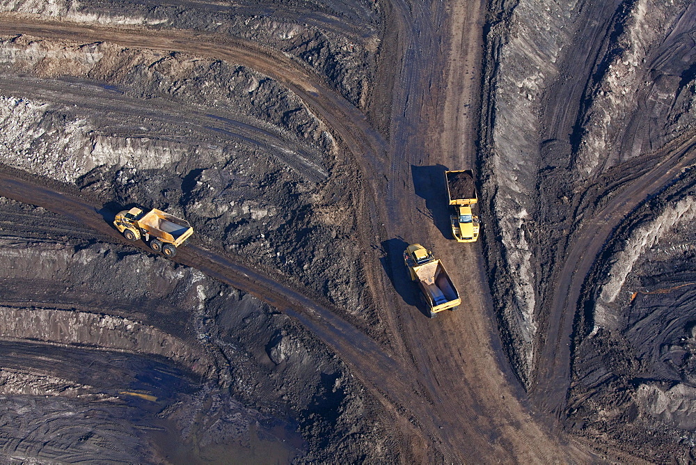 Aerial view of an open-pit lignite mine, Lorries transporting brown coal, Schoeningen, Lower Saxony, Germany